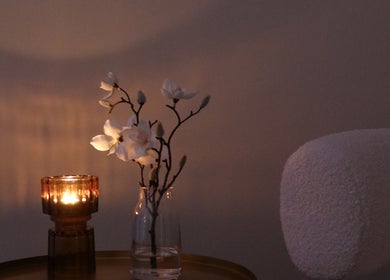 Candlelit floral arrangement at The Head Spa Perth, South Perth, Western Australia, AU for a tranquil ambiance.