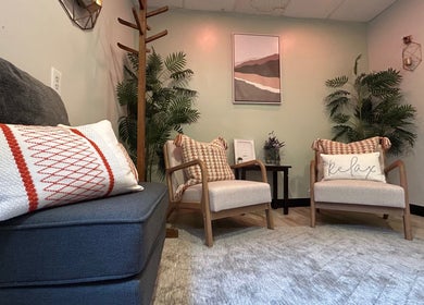 Inviting lounge area at Revive Integrative Wellness, Abilene, Texas, US, featuring plush seating and serene decor.