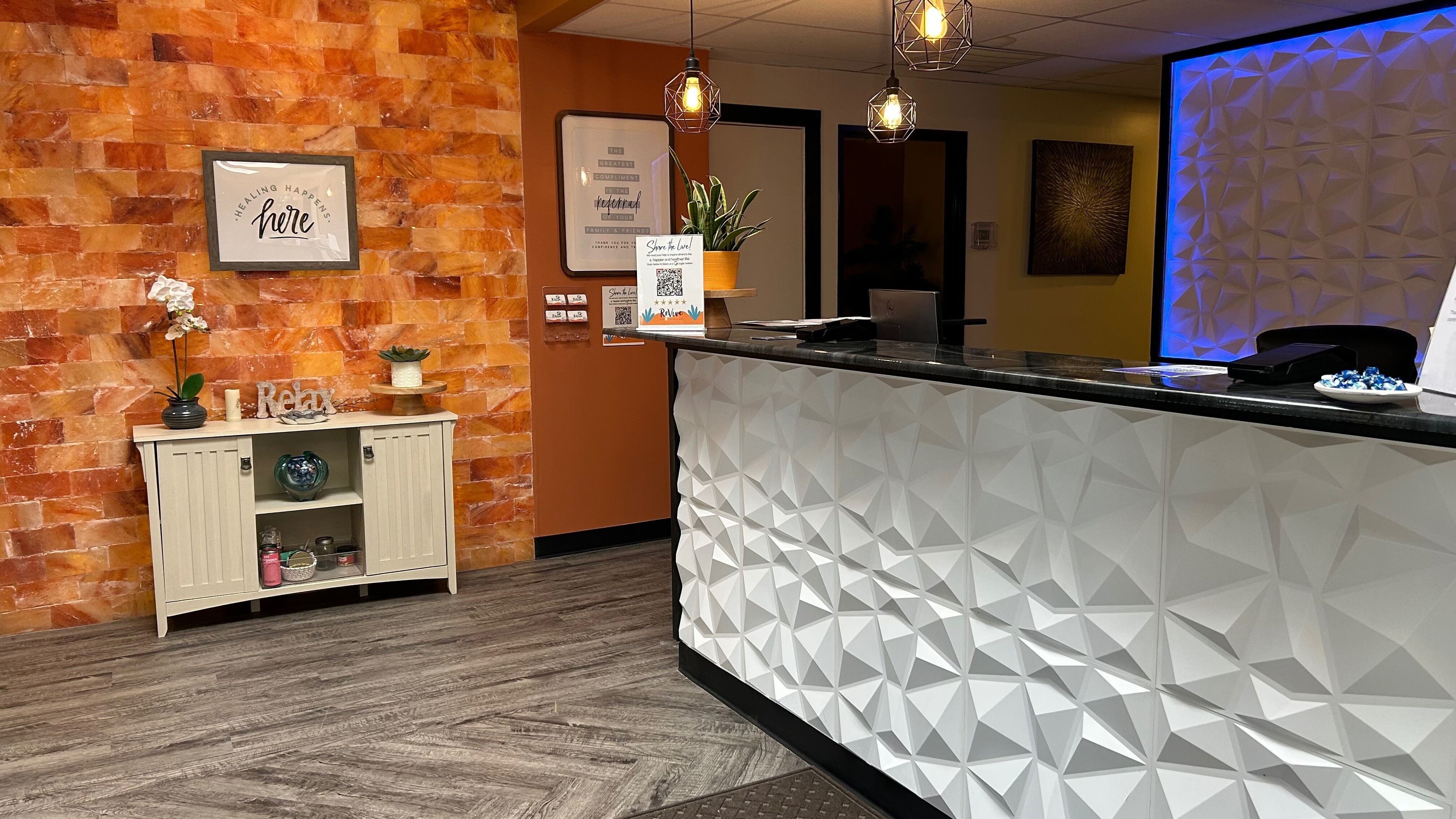 Reception area at Revive Integrative Wellness in Abilene, Texas features a warm, inviting design.