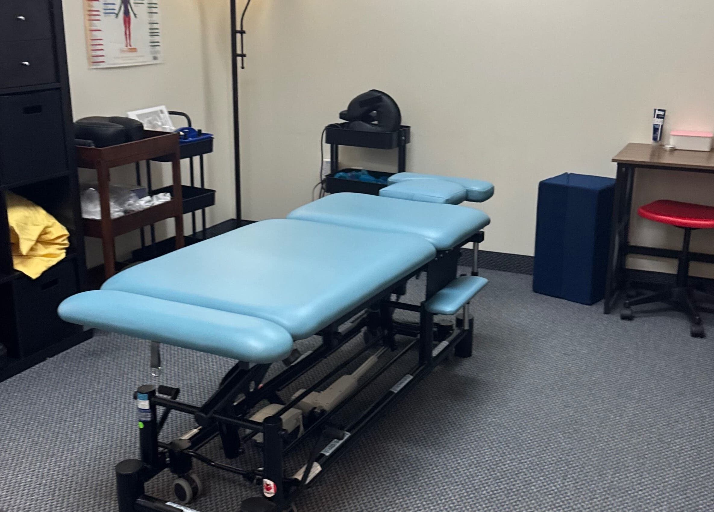 Therapy room at Revive Integrative Wellness | Grapevine, Texas featuring a massage table and calming decor.
