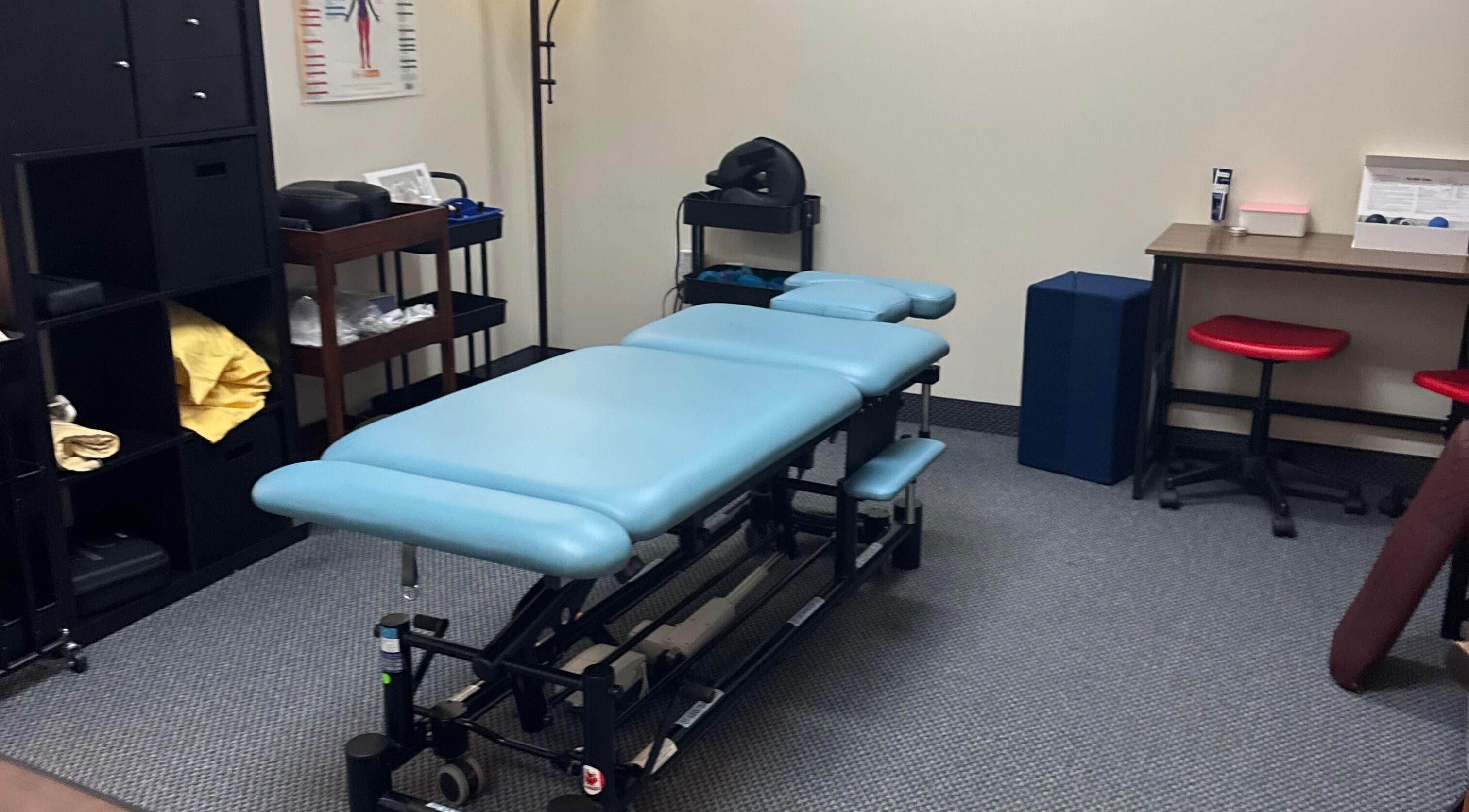 Therapy room at Revive Integrative Wellness | Grapevine, Texas featuring a massage table and calming decor.