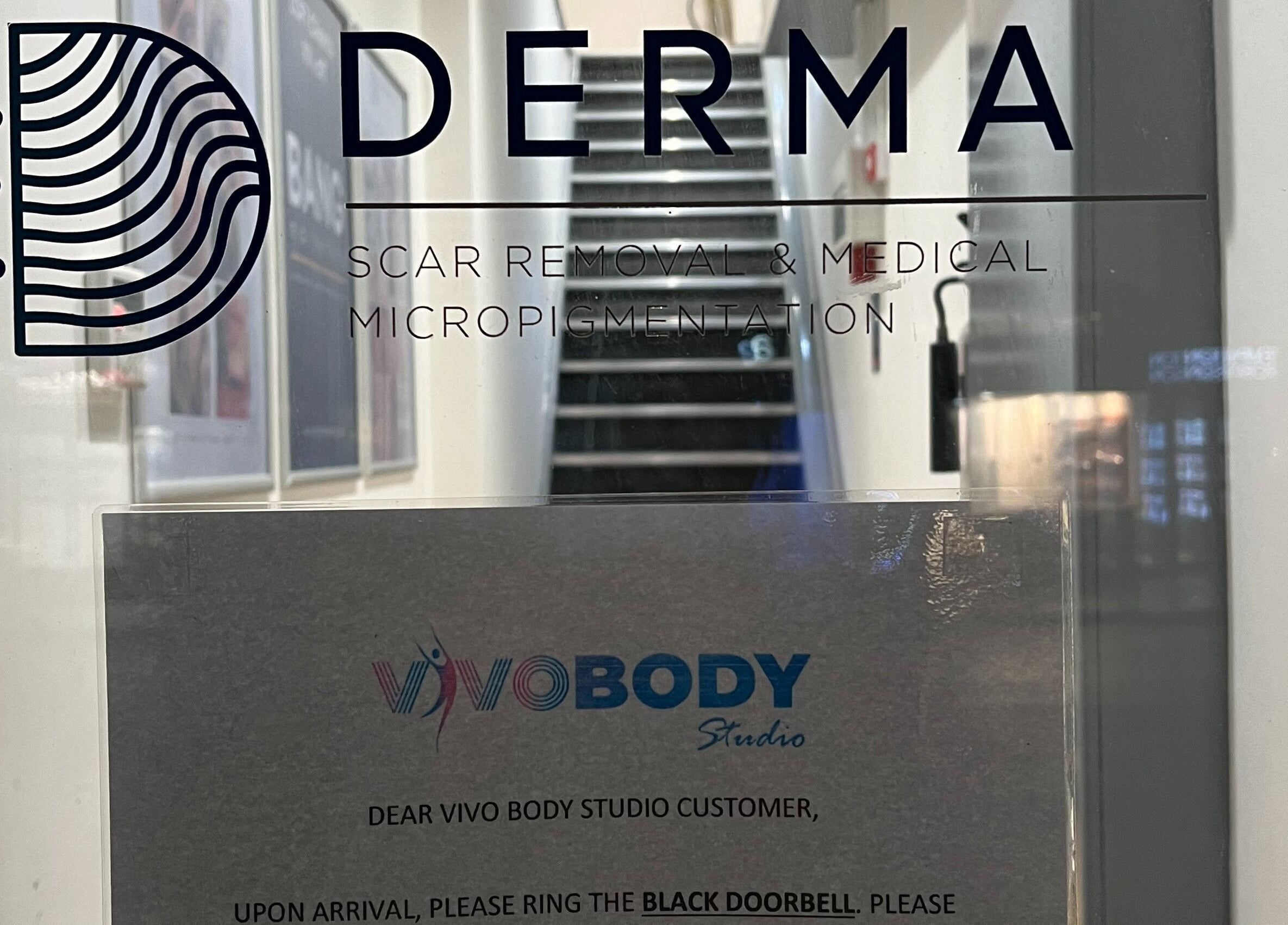 Vivo Body Studio Belfast entrance sign in Belfast, Northern Ireland, GB, showcasing services offered.