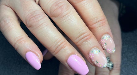 Detailed nail art with floral designs at Beauty By Eloise, Godshill, England, GB.