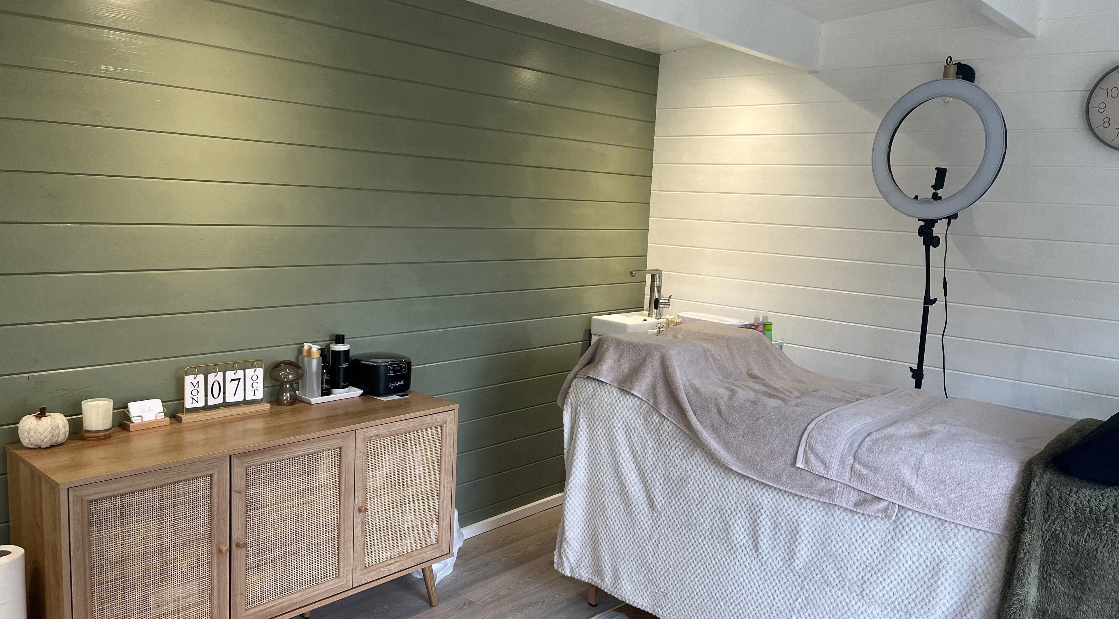 Relaxing treatment room at Beauty By Eloise, Godshill, England. Featuring cozy bed and aesthetic decor.