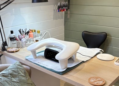 Modern manicure setup at Beauty By Eloise in Godshill, England, GB, featuring nail tools and products.