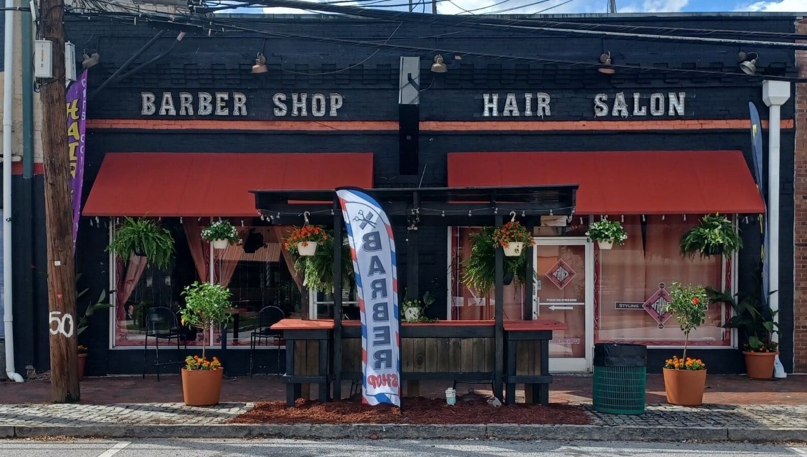 Front view of Locz by Lola, a stylish barber shop and hair salon in Lithonia, Georgia, US.