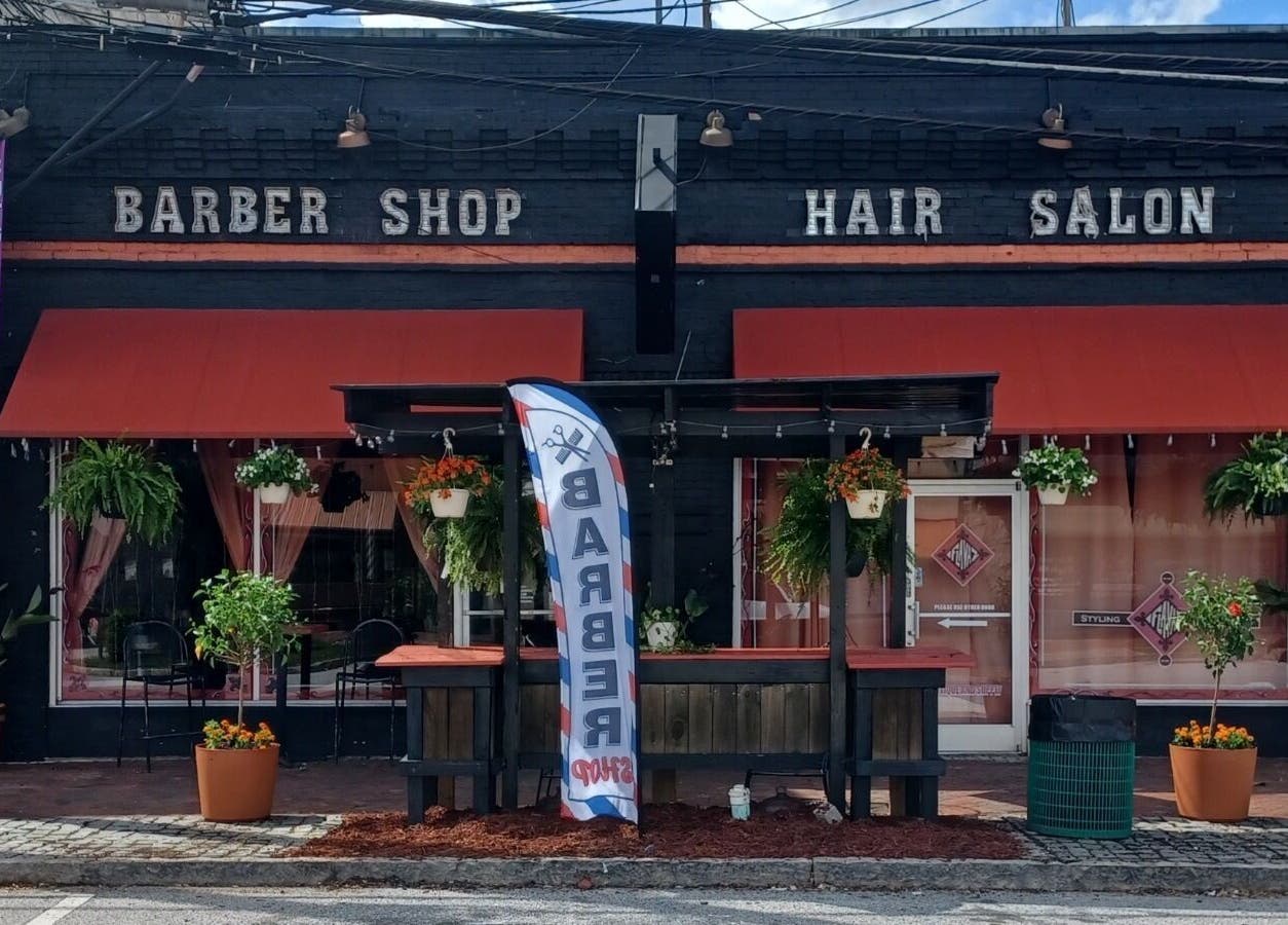 Front view of Locz by Lola, a stylish barber shop and hair salon in Lithonia, Georgia, US.