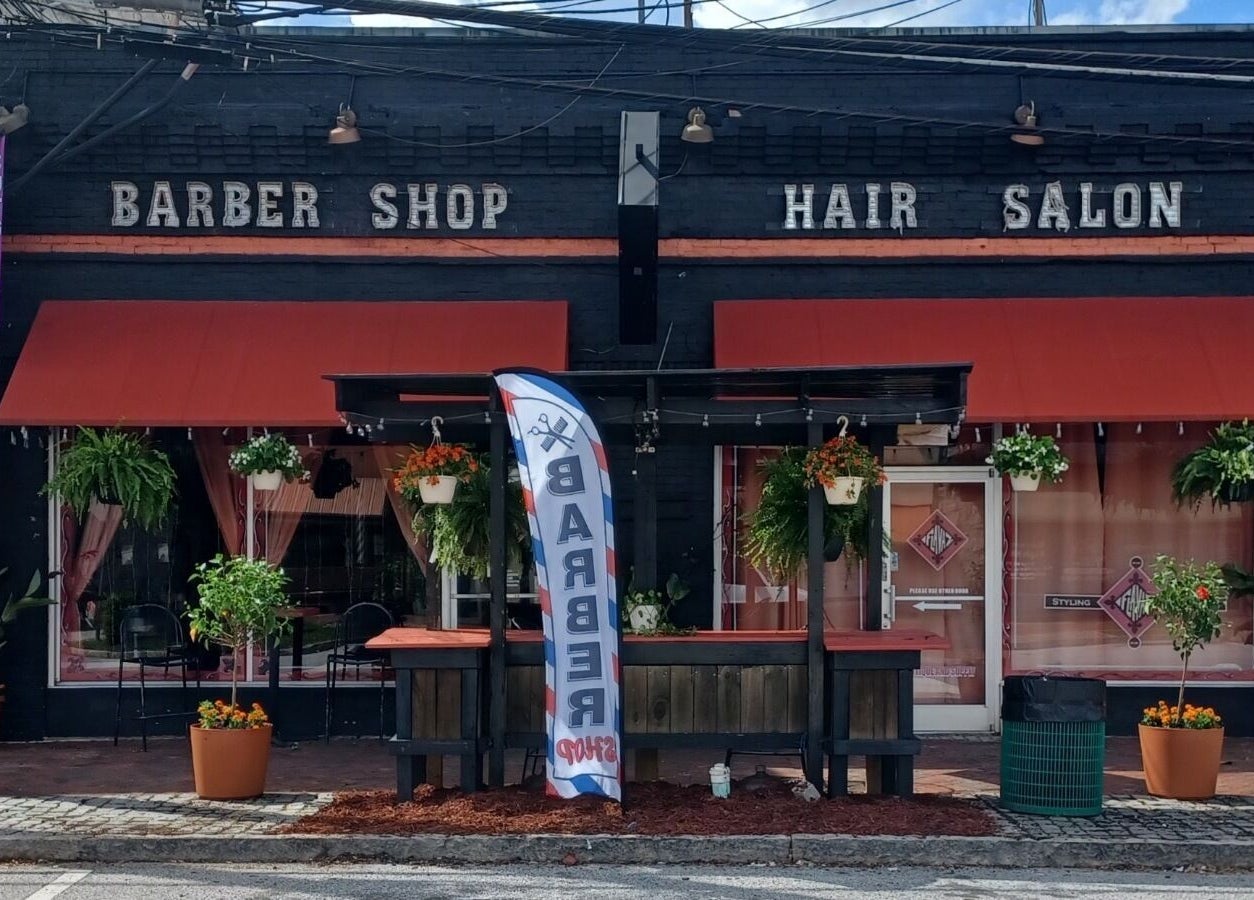 Front view of Locz by Lola, a stylish barber shop and hair salon in Lithonia, Georgia, US.