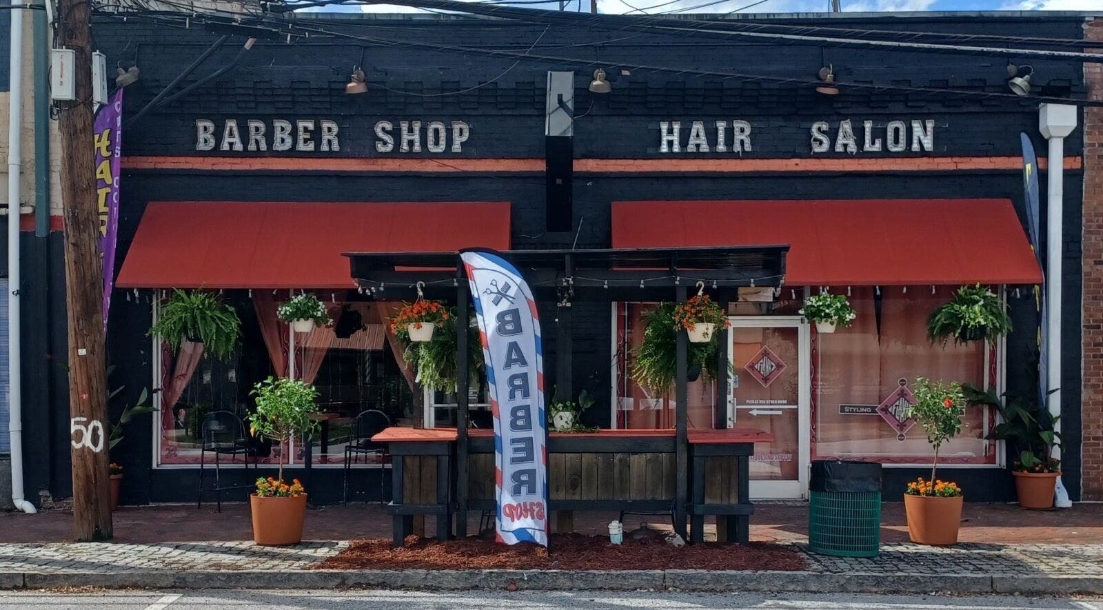 Front view of Locz by Lola, a stylish barber shop and hair salon in Lithonia, Georgia, US.