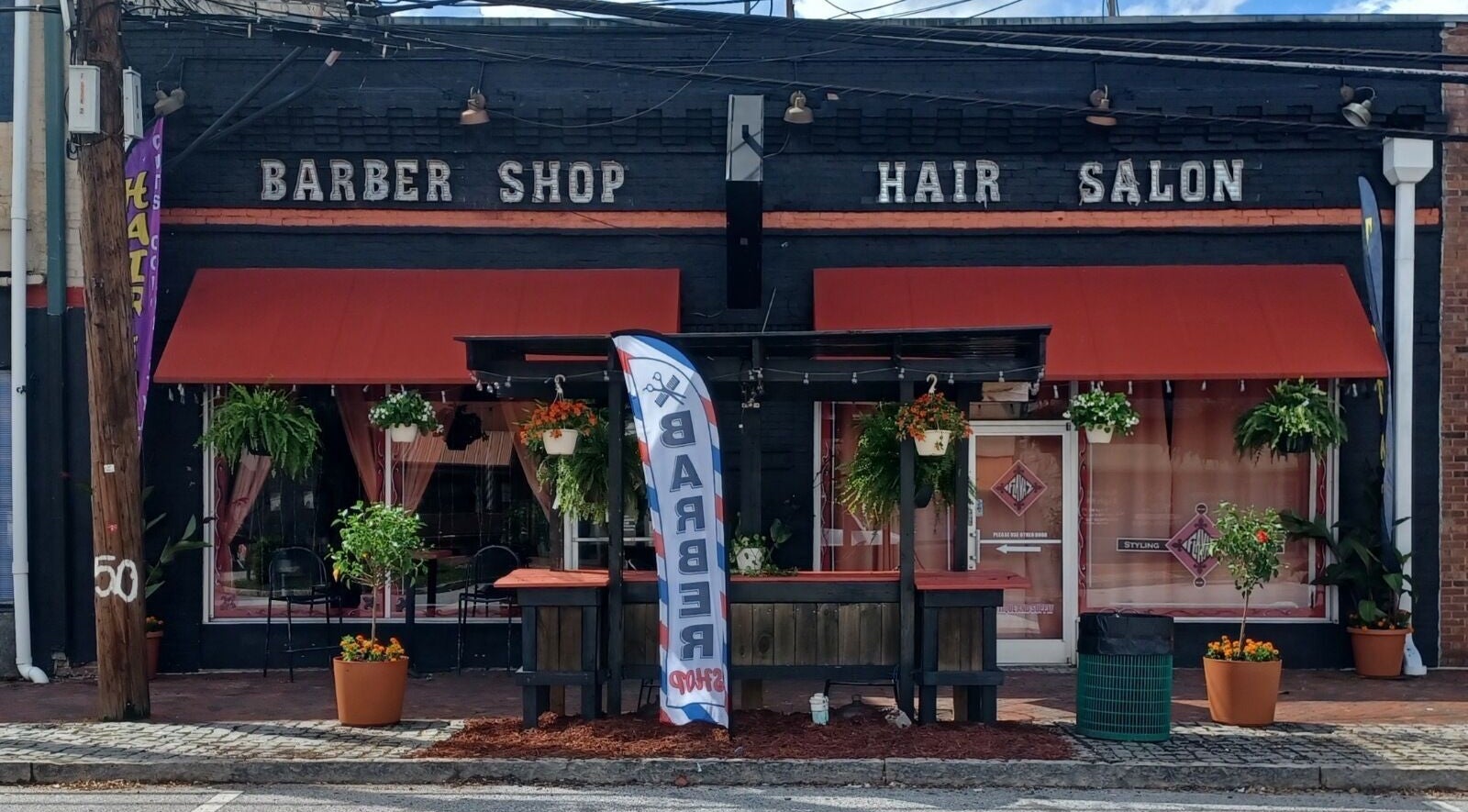 Front view of Locz by Lola, a stylish barber shop and hair salon in Lithonia, Georgia, US.