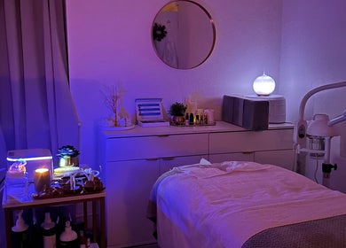 Serene wellness room at Reenas Touch, a beauty venue in London, England, GB, featuring calming decor and treatment bed.