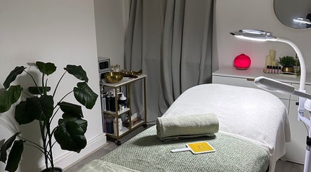 Luxury treatment room at Reena’s Touch in London, England, GB featuring a massage table and relaxing decor.