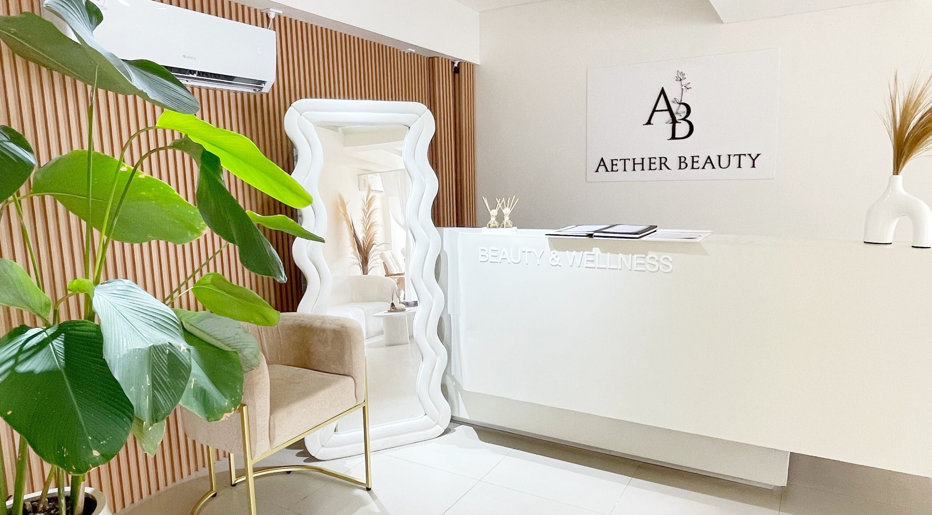 Reception at Aether Beauty in Bali, ID with modern decor and greenery.