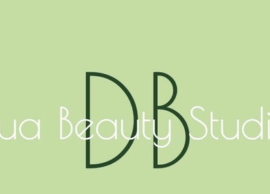 Elegant logo of Dua Beauty Studio in Brighton, England, GB on a soft green background.