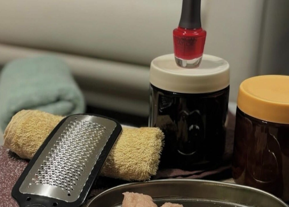 Manicure tools and red polish at Dua Beauty Studio, Brighton, England, GB offer a luxurious nail care experience.