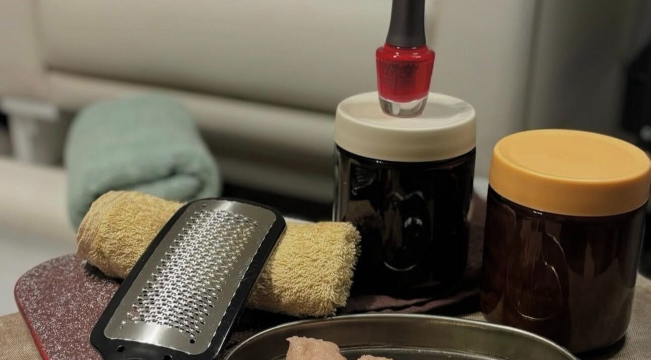 Manicure tools and red polish at Dua Beauty Studio, Brighton, England, GB offer a luxurious nail care experience.
