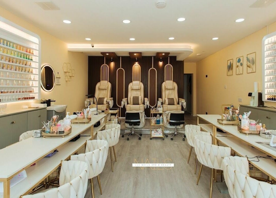 Lux Nail Spa & Beauty interior in London, England, GB with elegant pedicure chairs and modern decor.