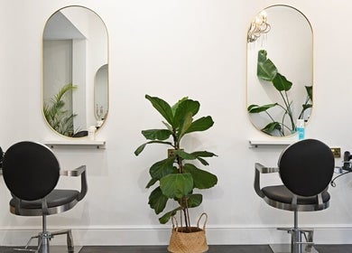 Modern salon chairs and mirrors at Verve, Matlock, England, GB create a chic and comfortable setting.