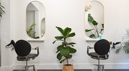 Modern salon chairs and mirrors at Verve, Matlock, England, GB create a chic and comfortable setting.