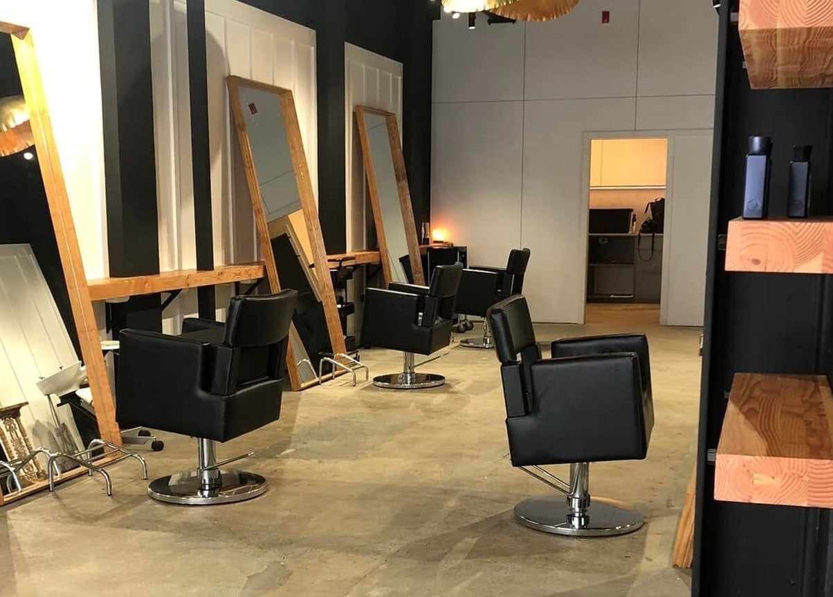 Modern salon chairs and mirrors at Rah in Hastings, Hawke's Bay, NZ, offering a contemporary beauty experience.