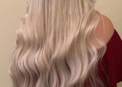 Long silky blonde waves styled at Dollified Hair & Beauty, England, England, GB.