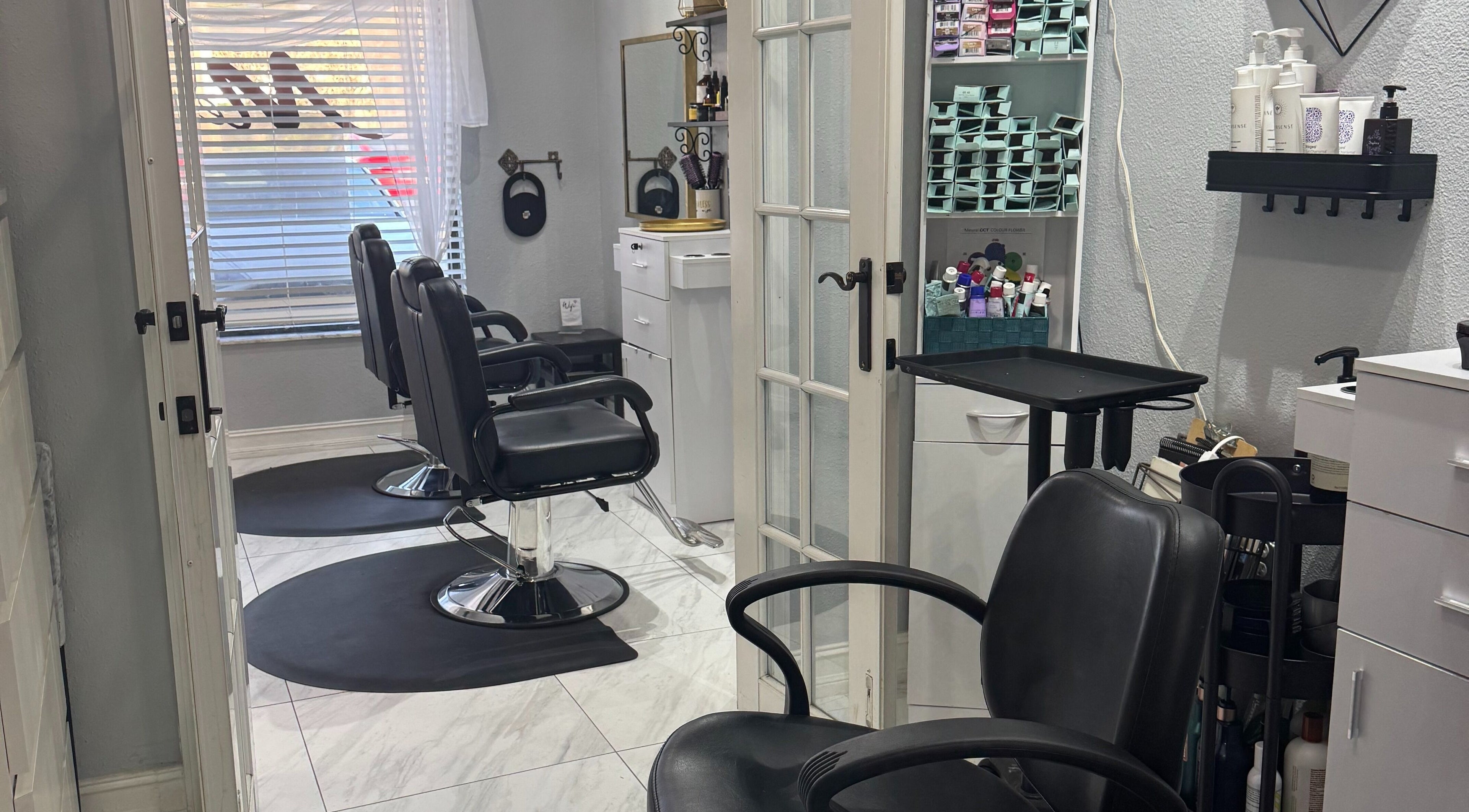 Modern salon chairs and styling area at Flawless Lounge ORL, Orlando, Florida, US.