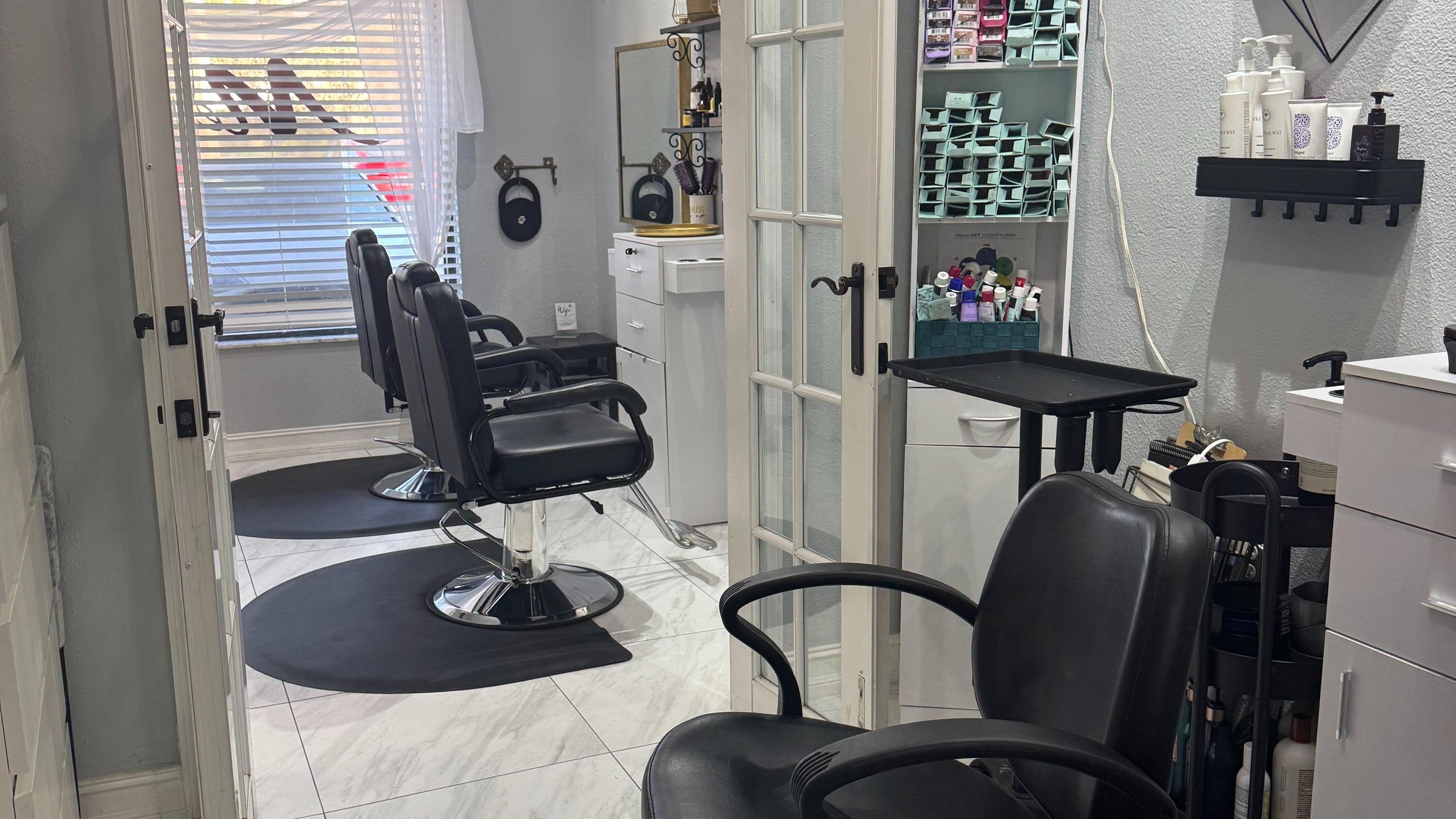 Modern salon chairs and styling area at Flawless Lounge ORL, Orlando, Florida, US.