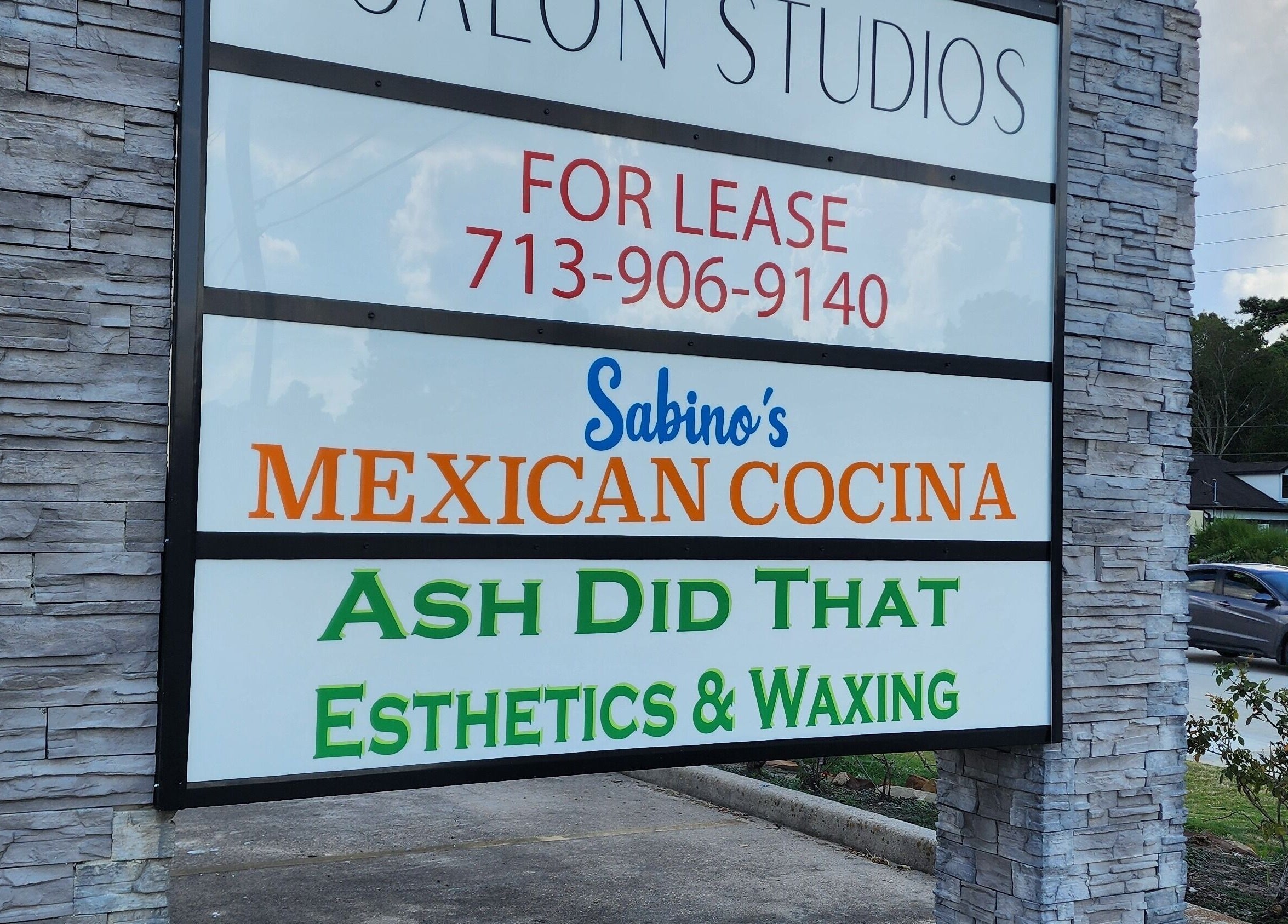 Street view of Ash Did That Esthetics & Waxing sign in Humble, Texas, US, promoting beauty services.