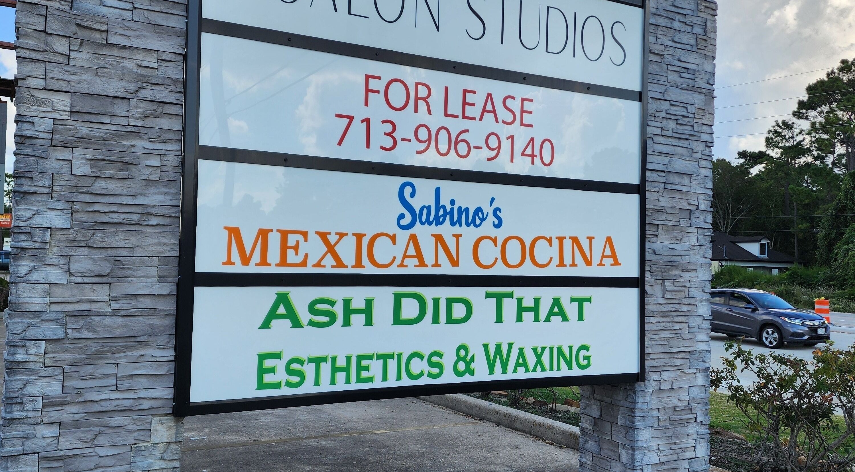Street view of Ash Did That Esthetics & Waxing sign in Humble, Texas, US, promoting beauty services.