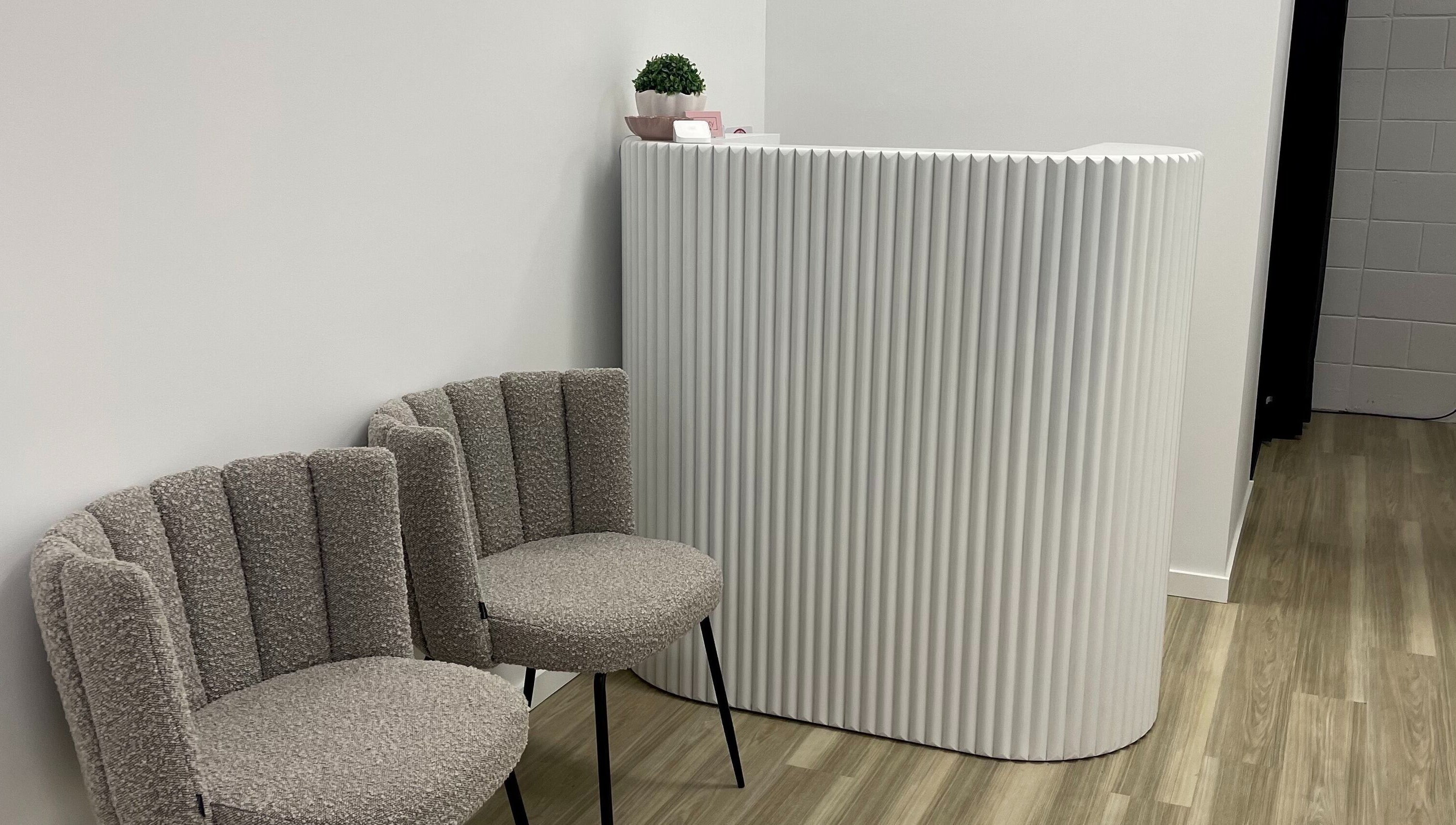 Elegant reception area at Beauty by B, Echuca, Victoria, AU with modern decor and cozy seating.