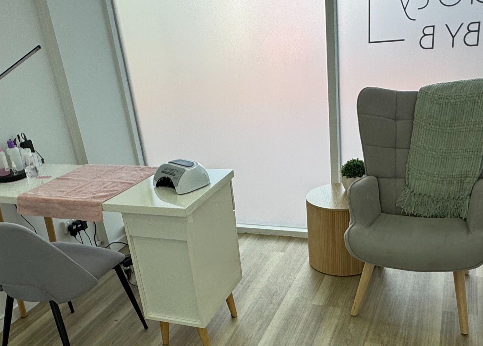 Modern nail station at Beauty by B, Echuca, Victoria, AU, showcasing elegant decor and comfortable seating.