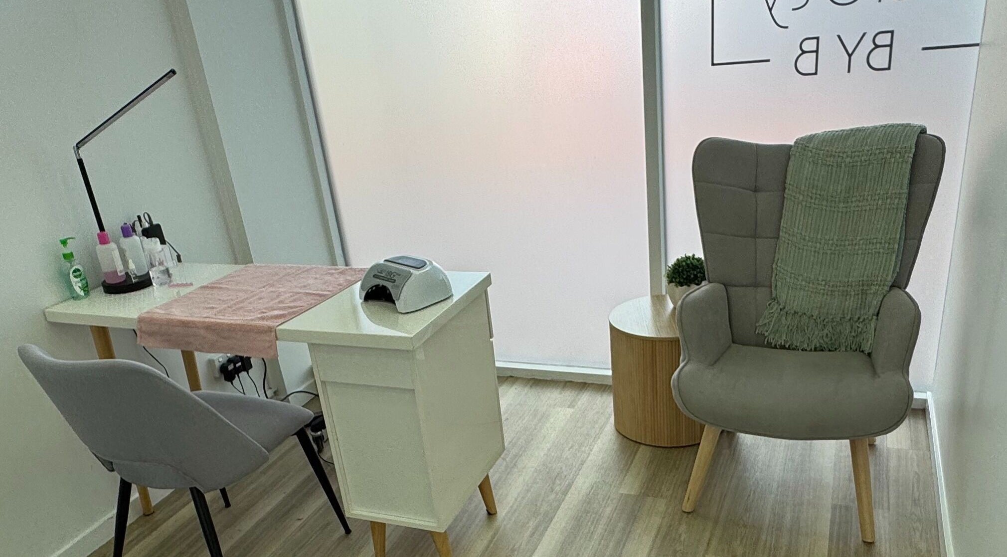 Modern nail station at Beauty by B, Echuca, Victoria, AU, showcasing elegant decor and comfortable seating.