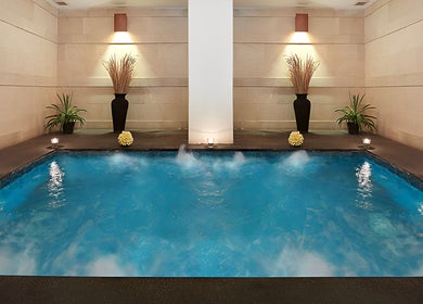 Relaxing indoor pool at Visala Spa The Magani, with ambient lighting in Bali, Bali, ID.