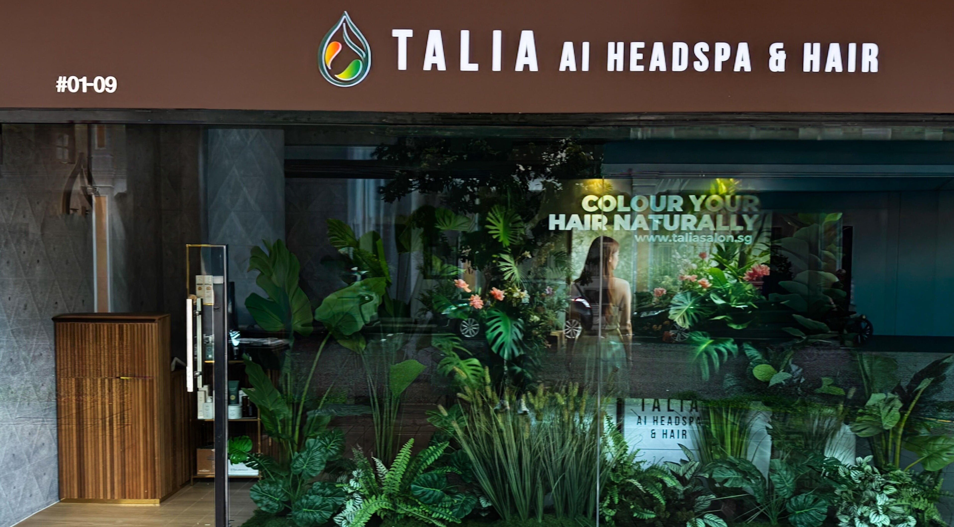 Exterior of Talia Hair and Beauty in Singapore, SG, showcasing lush, vibrant greenery and modern design.