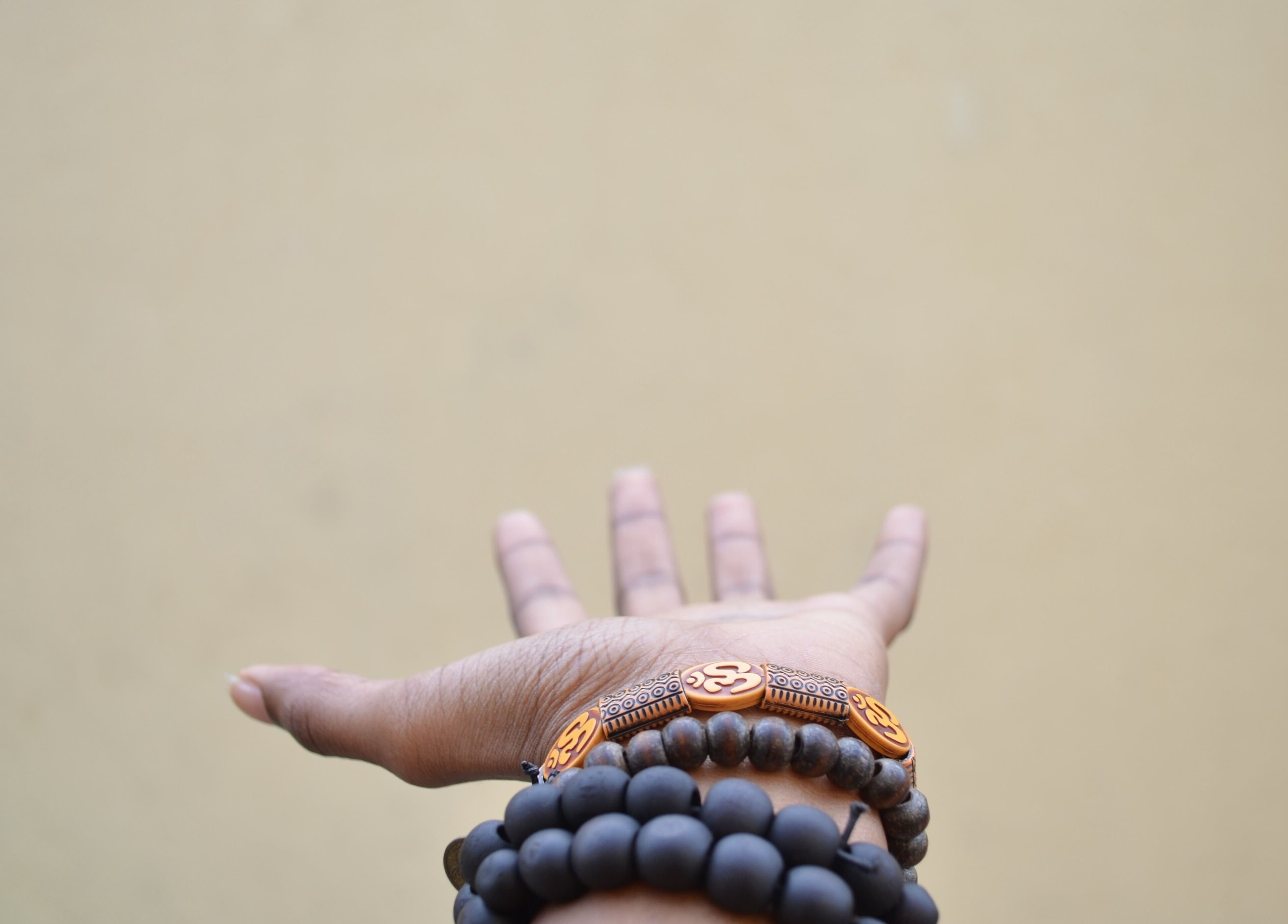 Outstretched hand with beaded bracelets at Sage Therapeutic Soul Spa, Tahoe City, California, US.