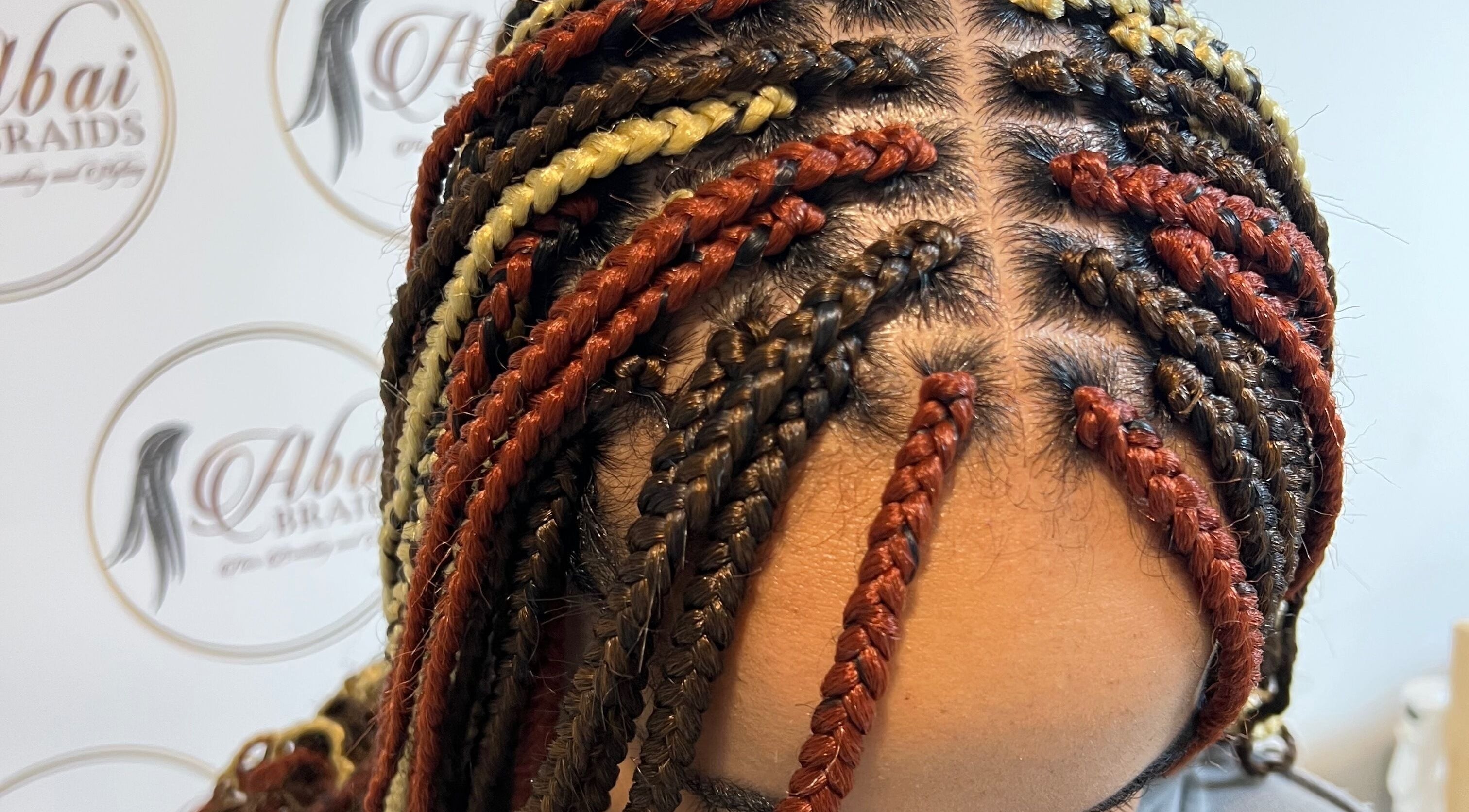 Colorful braided hairstyle at Abai Braids, Parramatta, New South Wales, AU, showcasing expert styling.