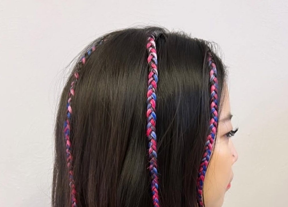 Vibrant braided hairstyle at Abai Braids, Parramatta, New South Wales, AU.