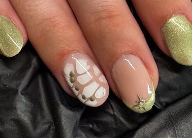Stylish green and white nail art at Studio Gelle, Standish, England, GB featuring intricate detailing.