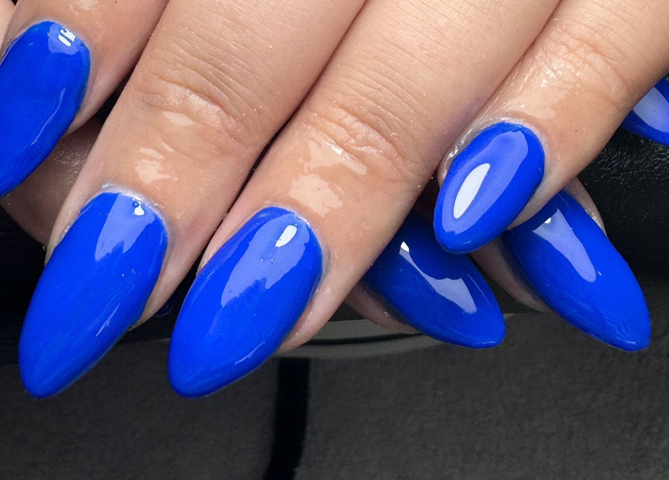 Stunning cobalt blue nail art at Studio Gelle, Standish, England, GB.