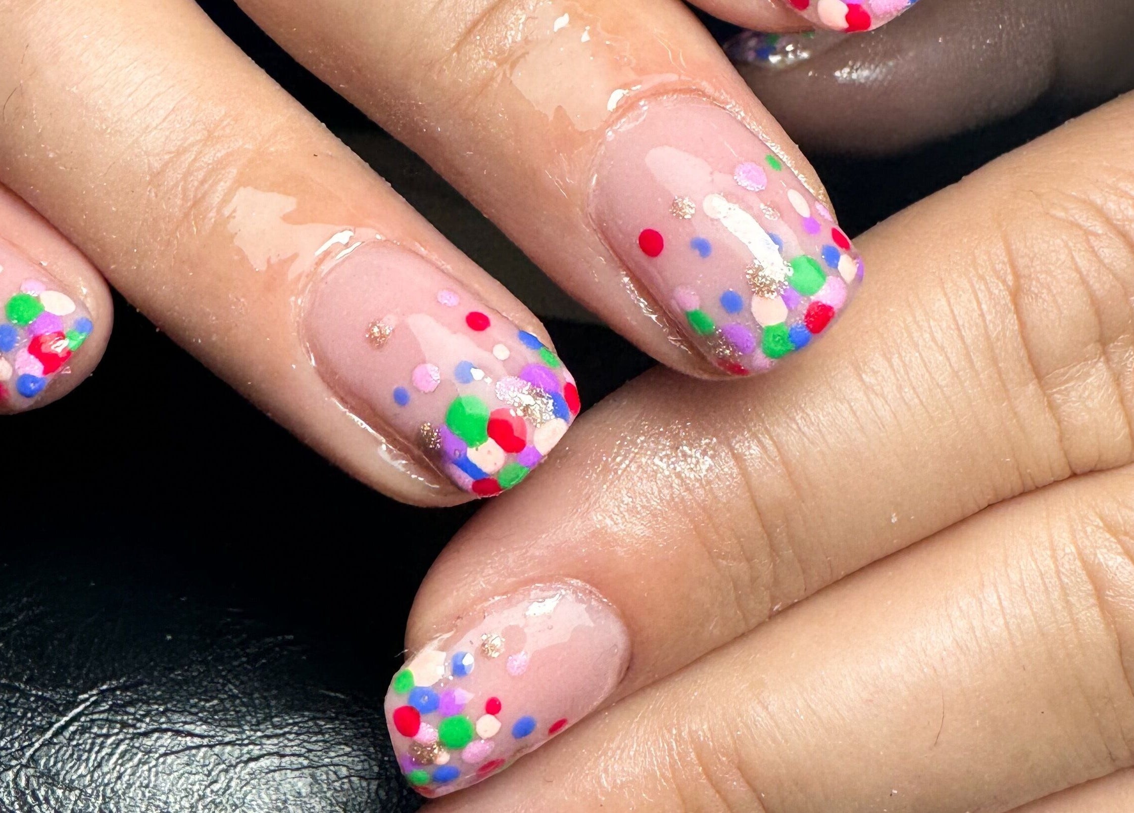 Vibrant confetti nail art at Studio Gelle, Standish, England, GB.