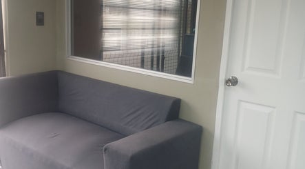 Gray sofa by the door at Zsquared Hair And Beauty Salon in Phoenix, Kwazulu-natal, ZA.