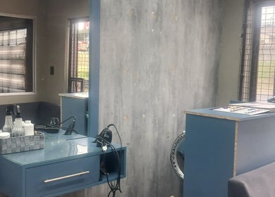 Modern styling station at Zsquared Hair And Beauty Salon in Phoenix, Kwazulu-natal, ZA with sleek blue decor.