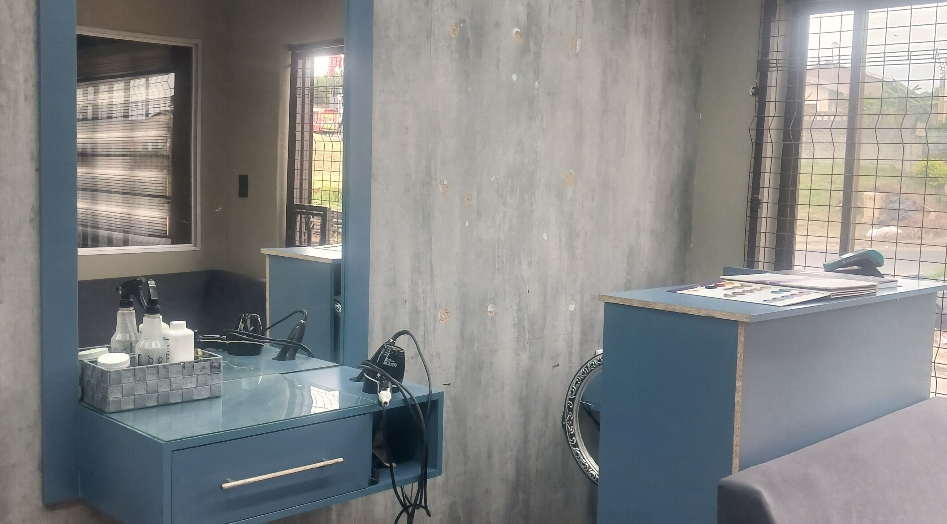 Modern styling station at Zsquared Hair And Beauty Salon in Phoenix, Kwazulu-natal, ZA, showcasing sleek design.