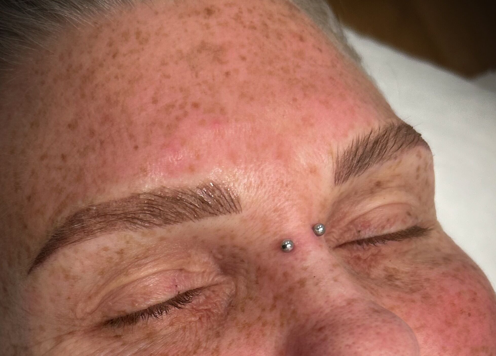 Close-up of perfectly sculpted eyebrows post-tattoo at Queensland Cosmetic Tattooing, Kingaroy, Queensland, AU.