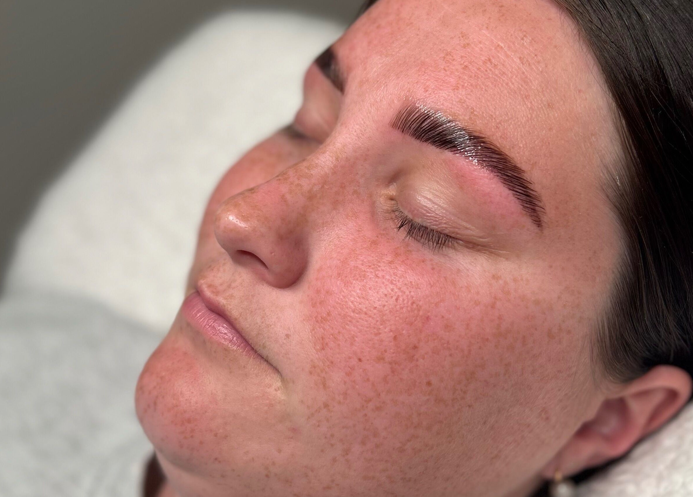 Close-up of woman with freshly tattooed eyebrows at Queensland Cosmetic Tattooing in Kingaroy, Queensland, AU.