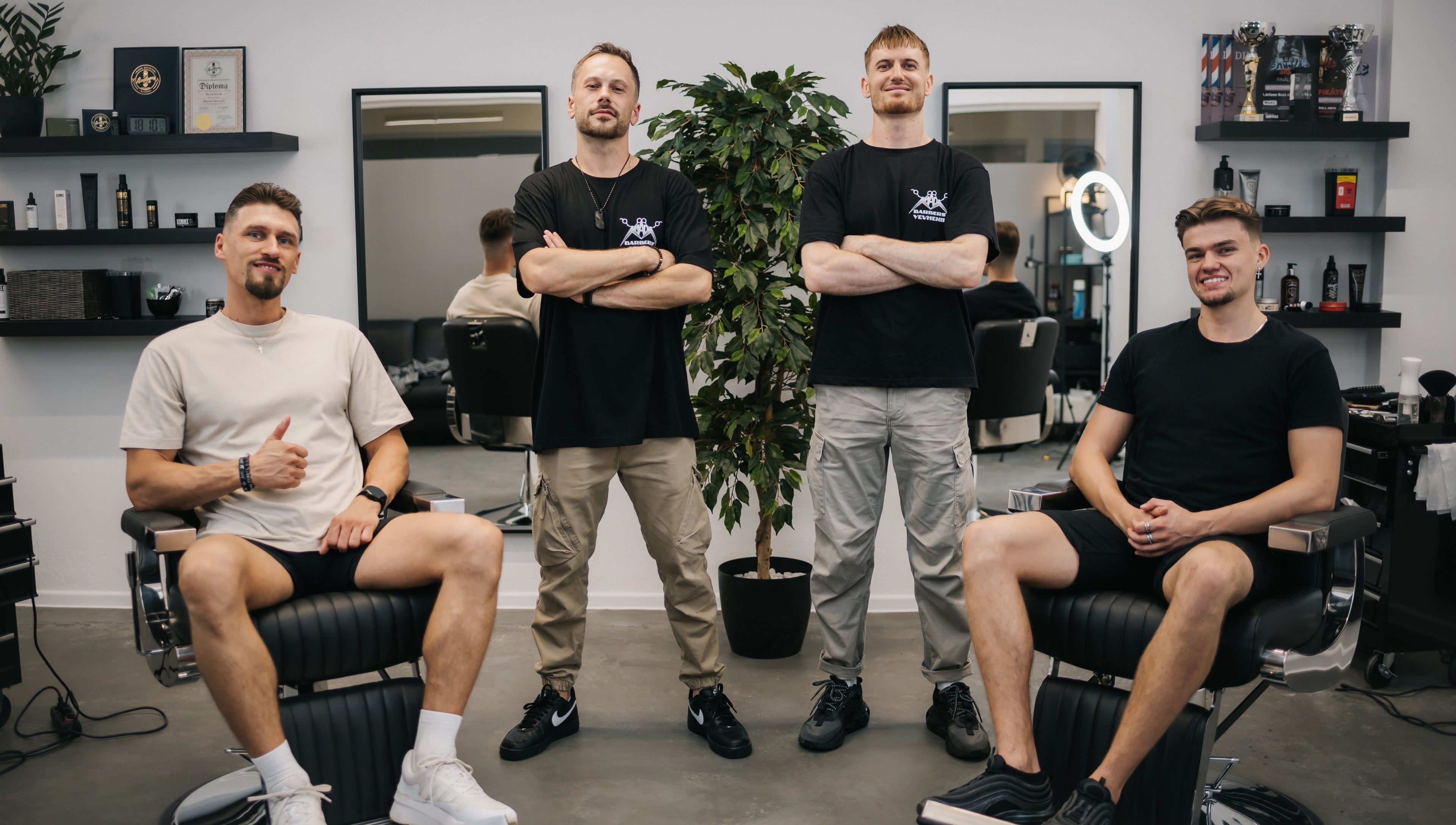 Team at MAD BARBERS in Jelgava, LV, showcasing style in a modern space.