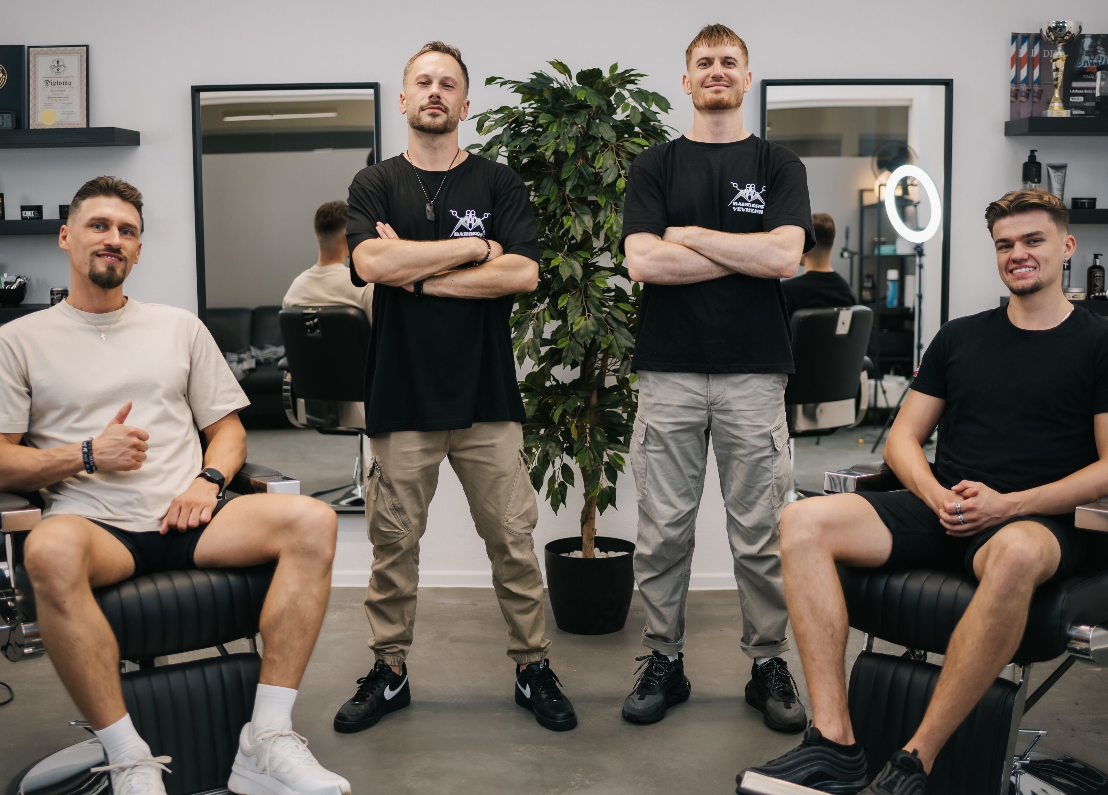 Team at MAD BARBERS in Jelgava, LV, showcasing style in a modern space.