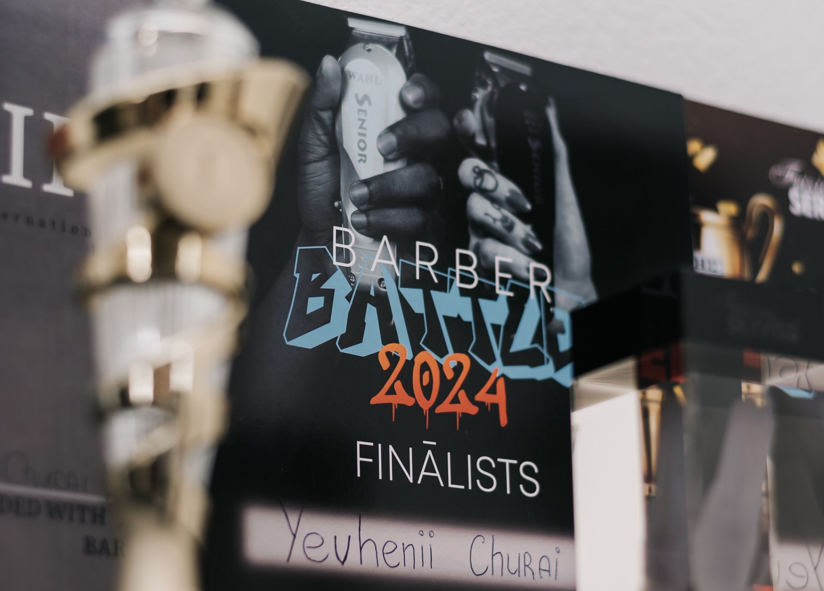 Barber Battle 2024 finalists poster at MAD BARBERS, Jelgava, LV showcasing professional barber tools.