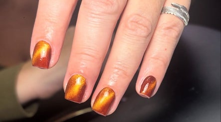 Vibrant golden nails at Juicy Beauty, Gateshead, England, GB. Stunning manicure showcasing brilliant shine.