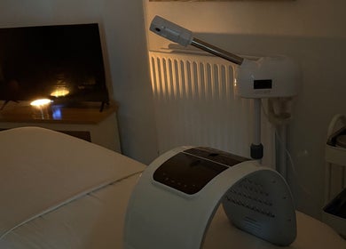 Tranquil treatment room at Spirituellefacials, London, England, GB, with ambient lighting and modern equipment.